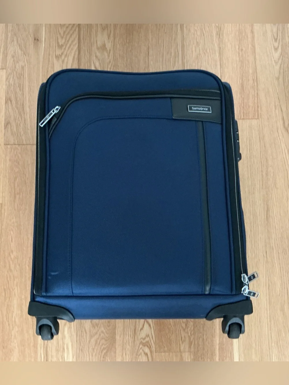 Samsonite Optimum softside spinner carry-on suitcase.